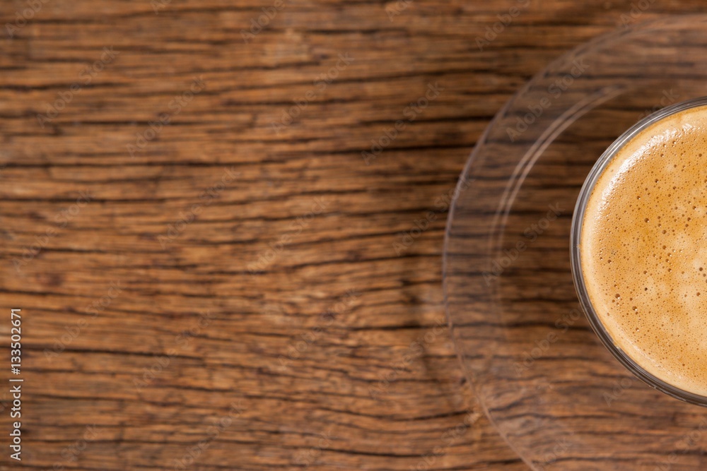 Cup of coffee on wooden table Cup of coffee on wooden table