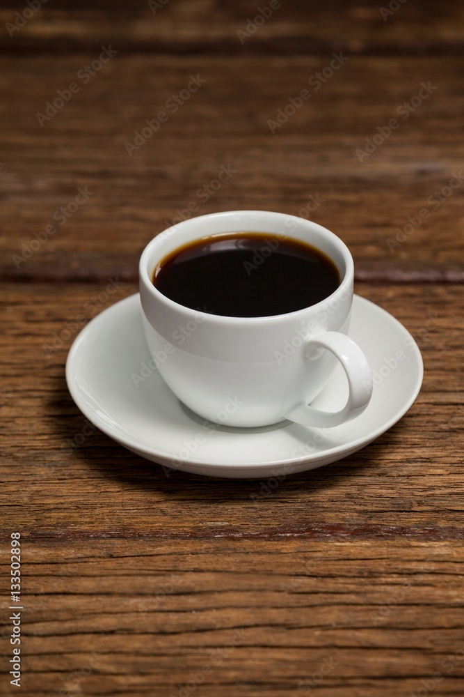 Cup of coffee on wooden table Cup of coffee on wooden table