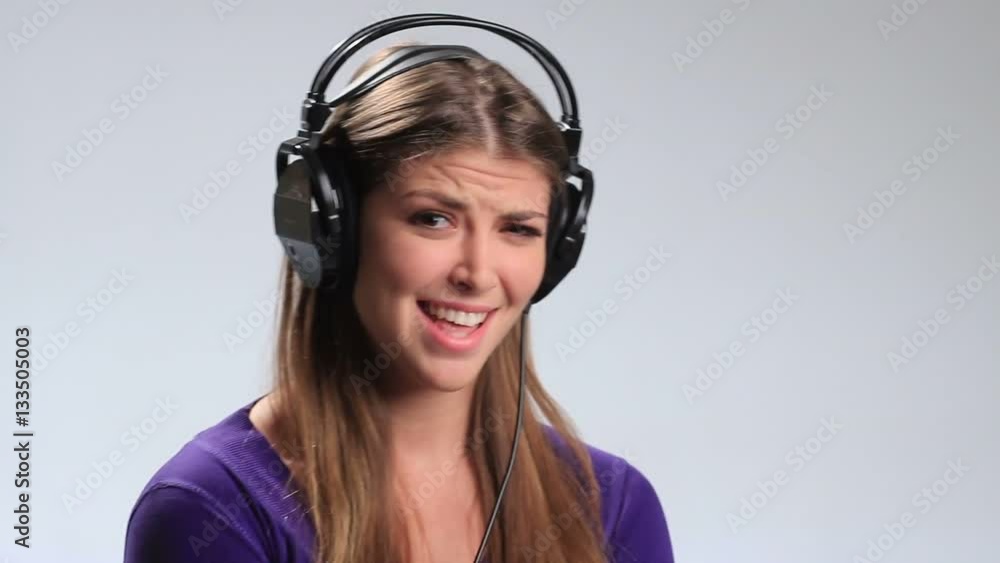 Excited brunette girl in headphones enjoying music Excited brunette girl in headphones enjoying music