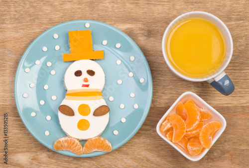 Funny sandwich for kids in a shape of a snowman