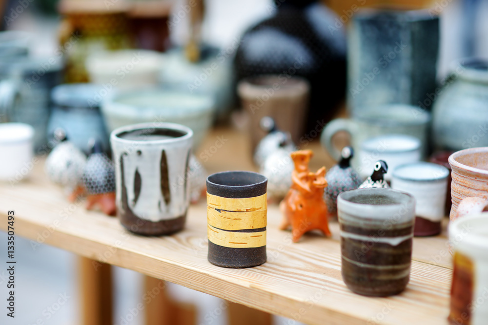 Ceramic dishes, tableware and jugs sold on Easter market in Vilnius, Lithuania Ceramic dishes, tableware and jugs sold on Easter market in Vilnius, Lithuania