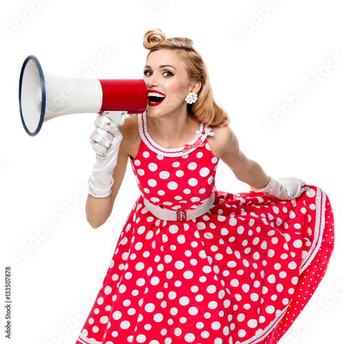 woman holding megaphone, dressed in pin-up style dress photo