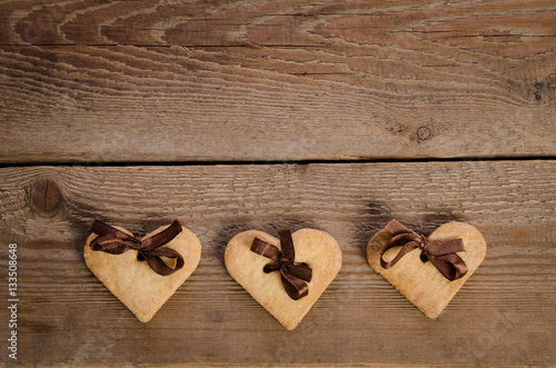  cookies-hearts on wooden table