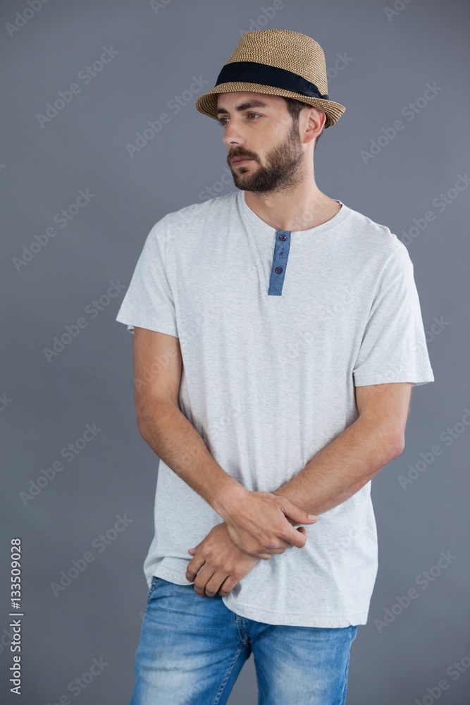 Man in white t-shirt and fedora hat Man in white t-shirt and fedora hat