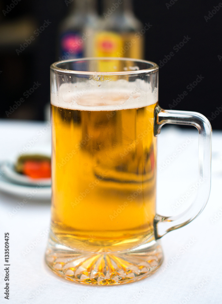 Cold glass of beer on the table. Cold glass of beer on the table.