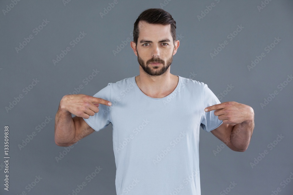 Portrait of man posing in grey t-shirt Portrait of man posing in grey t-shirt