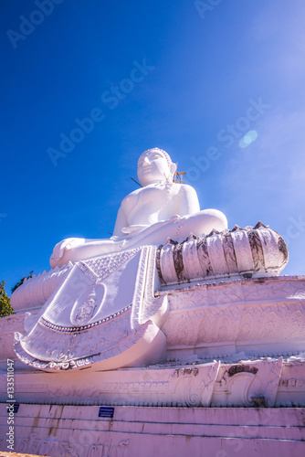 White buddha statue under construction at Phra That Maeyen templ photo