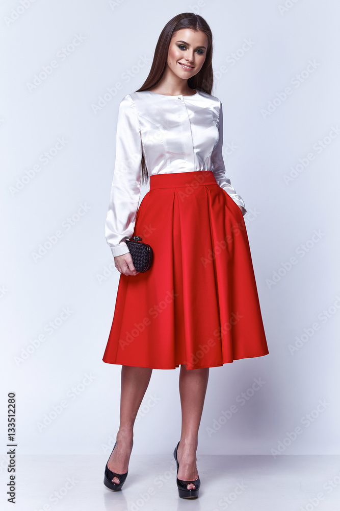 Beautiful woman lady spring autumn collection glamor model business office  fashion clothes wear casual style silk blouse red long skirt black pretty  face dark hair white background studio. Stock Photo | Adobe
