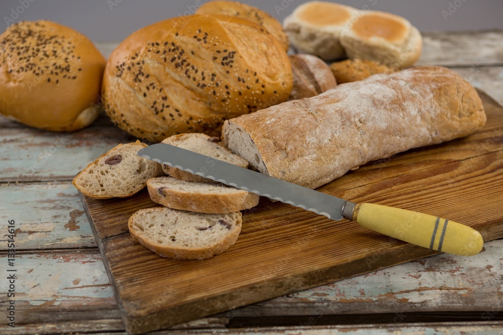 Various bread loaves with knife
