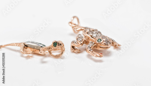 Gold pendants in the form of salamander and frog
