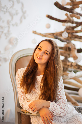 Cute girl smiling and posing in chair