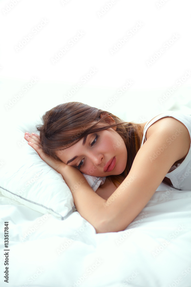Beautiful girl sleeps in the bedroom, lying on bed Beautiful girl sleeps in the bedroom, lying on bed