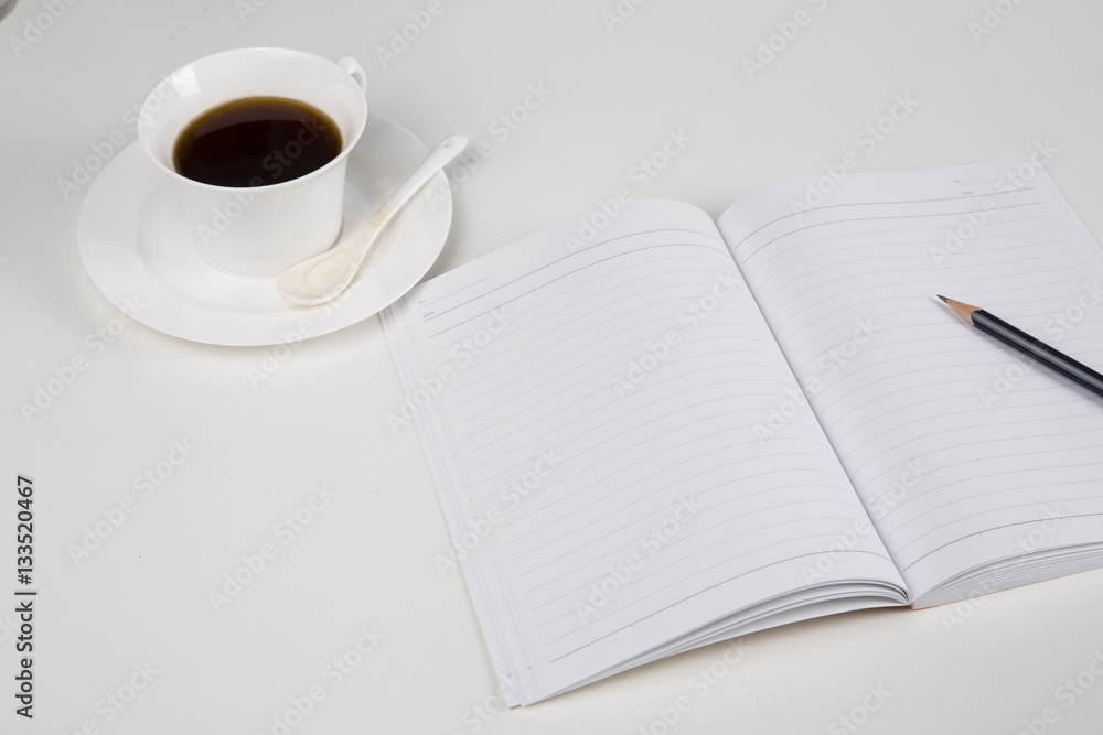 A desktop office. smart phone, coffee, notebook and pencil A desktop office. smart phone, coffee, notebook and pencil