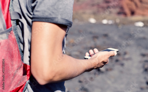 young man using a smartphone outdoors