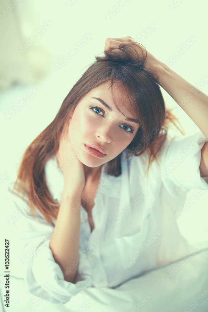 Portrait of beautiful woman on bed at bedroom Portrait of beautiful woman on bed at bedroom
