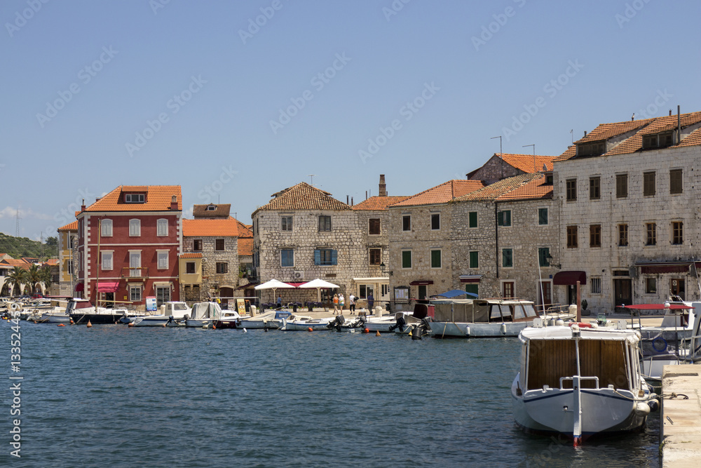 Obraz premium Houses near the sea in port of Stari Grad on adriatic island Hvar in Croatia, Europe