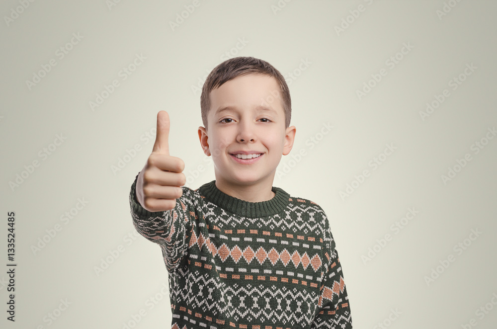 Emotions. Smiling boy looking at camera holding his finger up. Emotions. Smiling boy looking at camera holding his finger up.