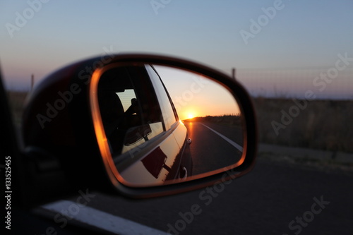 Sunset in a rear view mirror photo