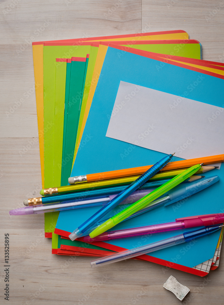 Fototapeta premium Notebooks and pens with pencils