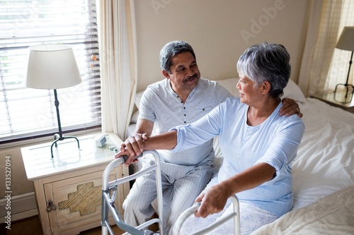 Senior couple interacting with each other on bed