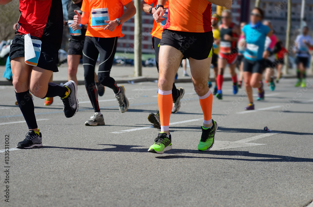 Marathon running race, runners feet on road, sport, fitness and healthy lifestyle concept
