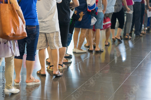 Fototapeta Naklejka Na Ścianę i Meble -  Closeup Queue of Asian people waiting at boarding gate at airport