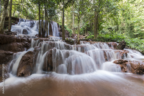 Beautiful waterfall in deep forest, Pa Wai Waterfall in tropical rain forest, Khirirat, Phop Phra, Tak, Thailand
