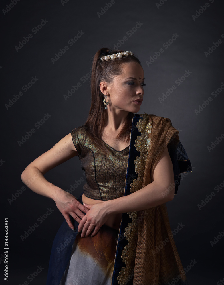 Fototapeta premium Dancing woman in the national Indian costume