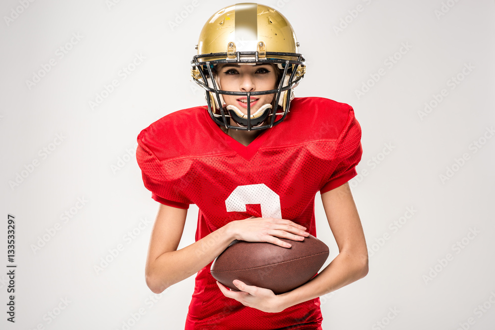 Beautiful female american football player StockFoto Adobe Stock