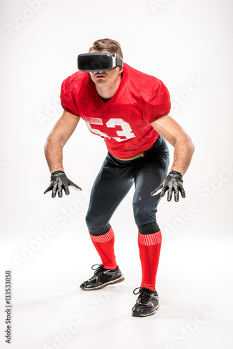 Football player in virtual reality headset