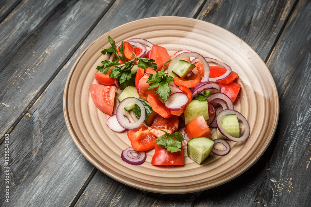 top view of a mixed vegetable salad on ceramic plate top view of a mixed vegetable salad on ceramic plate
