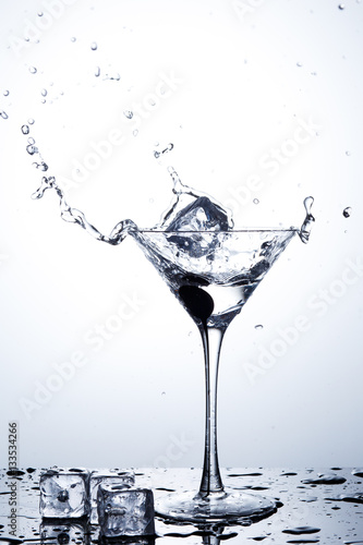 Water splash in martini glass © Poter_N
