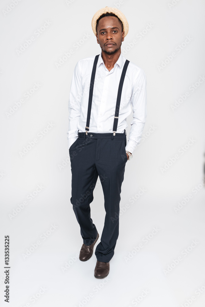 Handsome african man wearing hat posing in studio Handsome african man wearing hat posing in studio