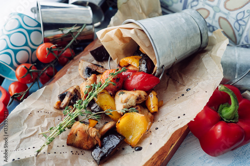 vegetables with slices of grilled chicken in a composition photo