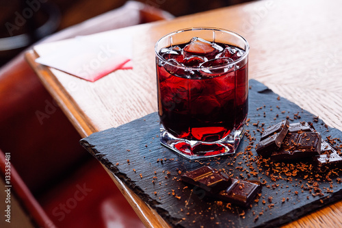 Glass of cherry juice with chocolate pieces