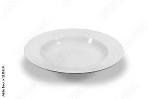 Soup deep white round plate with wide shoulders on white background from side