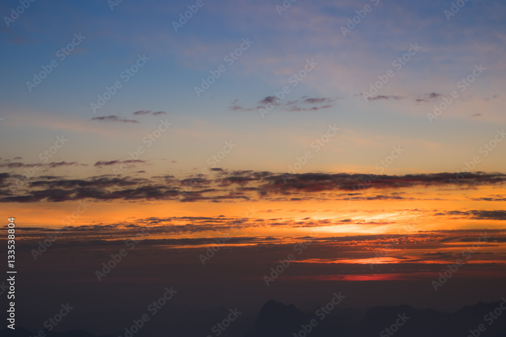 Fototapeta premium Dramatic sunset and sunrise over mountain morning evening sky.