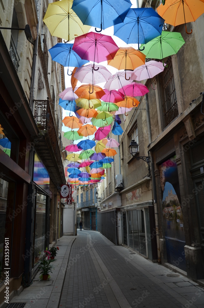 Umbrellas in a Beziers street