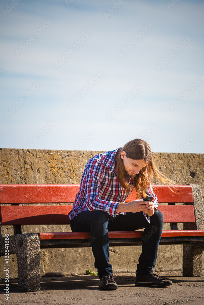 Man outdoor using cell phone