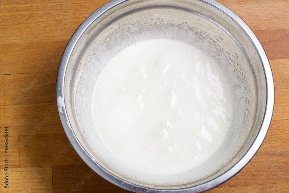 Dough for crepes or pancakes in bowl top view Dough for crepes or pancakes in bowl top view