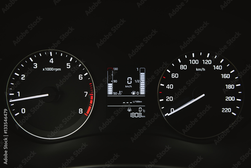 Fototapeta premium Car instrument panel, dashboard closeup with visible speedometer