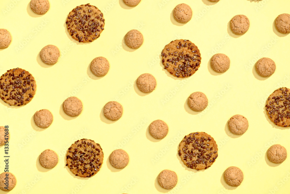 Pattern of cookies on a yellow background Pattern of cookies on a yellow background