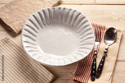 Empy white shell design bowl with cutlery
