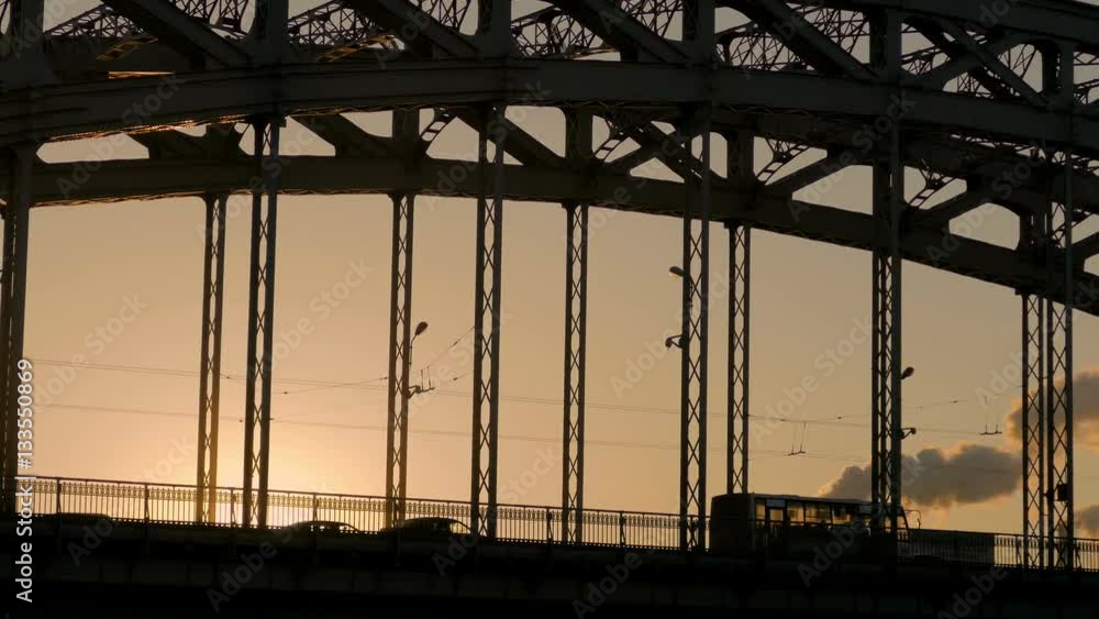 cars, trucks and buses cross the bridge in sunset time. Saint-Petersburg, Russia cars, trucks and buses cross the bridge in sunset time. Saint-Petersburg, Russia
