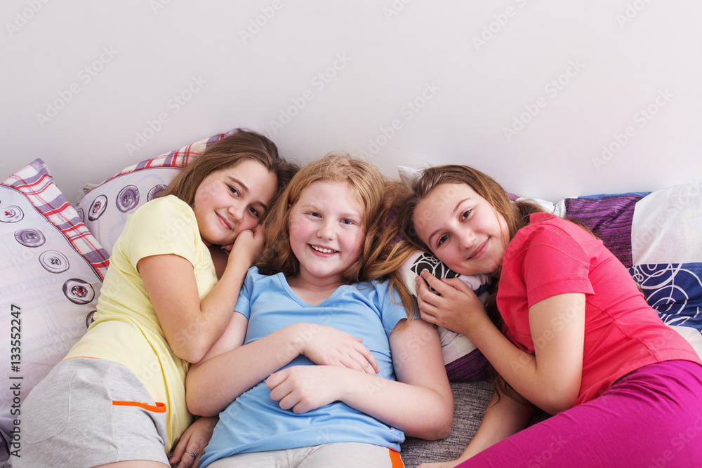 three happy girls at home