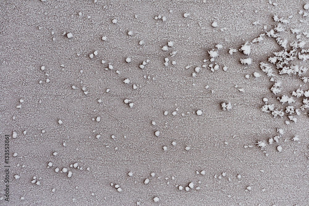 Frosty pattern of frozen snow on the surface Frosty pattern of frozen snow on the surface