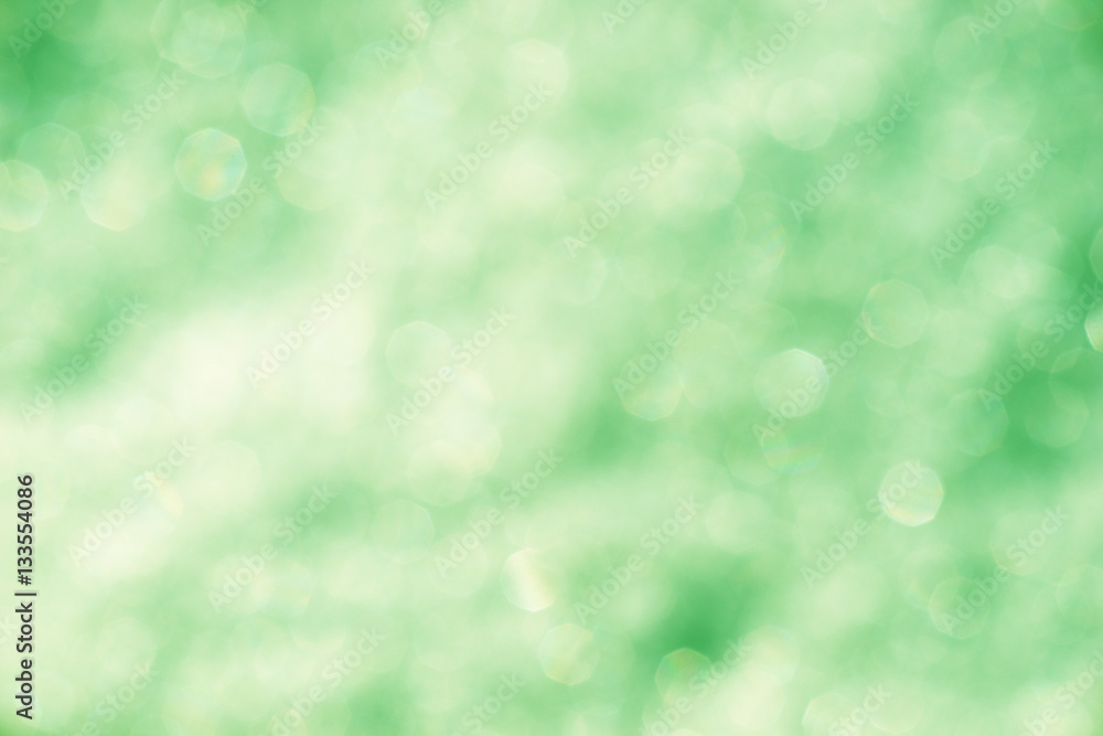 Fototapeta premium Blurred green background with bokeh lights