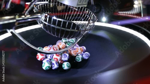 Colourful lottery balls in a lotto machine. Gambling machine and euqipment. photo