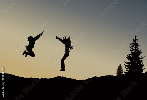 Silhouette of two  jumping girls with long hair on the wilderness. Sunset. © yik2007