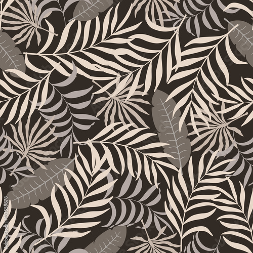 Tropical background with palm leaves. Seamless floral pattern